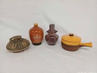 All four ceramic pieces side by side