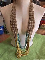 Necklace displayed on dress form front view