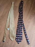 Both ties laid flat full length on floor