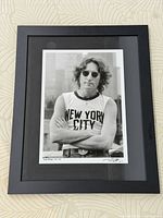 Framed black-and-white John Lennon print in full view