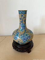Front view of cloisonné bud vase on stand