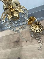Both sconces on floor showing overall design and crystals