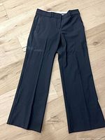 Full view of trousers front showing style, color, leg shape