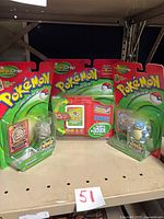 All three factory-sealed Pokémon THINKChip items on shelf