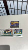 Stacked block of cards in original X-Men box with rubber band