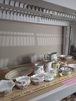 Group shot showing all 15 china pieces for scale and condition