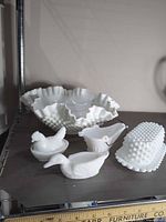 All eight milk glass pieces arranged together for identification