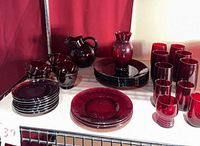 Full lot overview showing all ruby red glass items on shelf