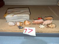 Group shot showing all pig figurines and stone trinket box