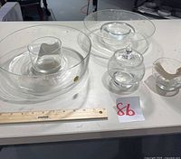 All five crystal pieces displayed with ruler for scale