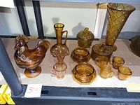 Shelf view showing all 12 amber glass items together