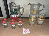 Full lot: both pitchers, five tumblers visible