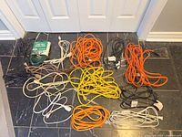 all cords laid out on floor showing quantity and colors