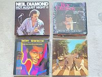 Four LPs: Neil Diamond Hot August Night II, Roy Orbison Greatest Hits, Chuck Berry Hail Hail Rock ’N’ Roll (sealed), Beatles Abbey Road