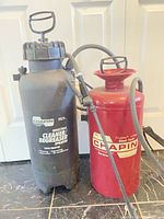 Both Chapin sprayers standing side by side showing overall condition and size
