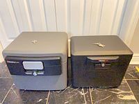 Front view of both Sentry safes showing locks and keys