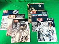 Six magazines spread out showing all covers