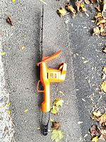 Side profile of Black & Decker hedge trimmer showing body, blade and cord