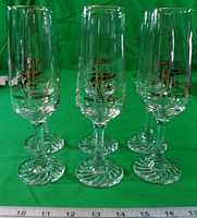 Full front view of all six commemorative flutes standing