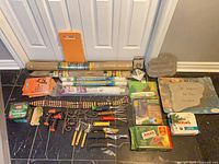 Entire lot laid out on floor showing all garden items