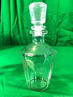 Full view of glass decanter with stopper assembled
