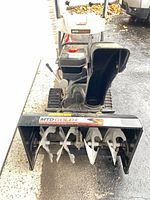 Front overview showing augers, chute and controls