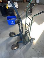 Side view of both hand trucks showing frame styles and wheels