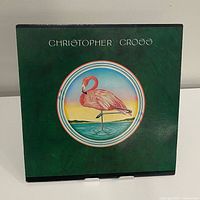 Front jacket with flamingo artwork and artist name