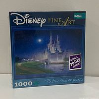 Front of sealed puzzle box showing artwork, Disney Fine Art and 1000 piece info