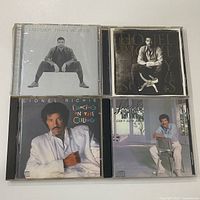Four Lionel Richie CD albums laid out front covers visible