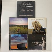 Front view of all five Mary Chapin Carpenter CDs laid out