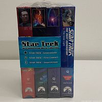 Front view of sealed four-tape Star Trek TNG VHS bundle