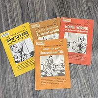 Front covers of the four Popular Mechanics DIY booklets showing titles and condition