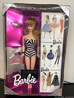 Front view of boxed 35th Anniversary Barbie showing doll, accessories and fashion illustrations