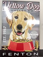 Front of metal display panel showing Yellow Dog Bullet Co. graphic