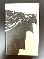 Front cover showing Batman silhouette artwork
