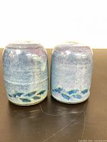 Front view of both shakers showing glaze pattern