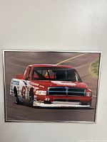 Full framed picture showing entire red Cummins Dodge #43 race truck image