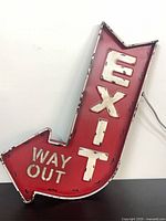 Front view showing red face with EXIT and WAY OUT lettering