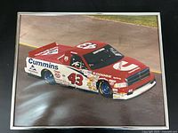 Full view of framed print showing entire race truck image
