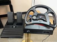 Front view of steering wheel and pedal unit