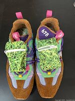 top view of shoes showing multicolor uppers, pouches, size tag 13