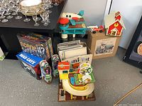 Group shot showing all three playsets, airplane, car and ride cars