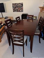 Full view of dining table with six chairs around it