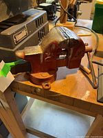 Left side view showing brand marking, anvil surface and swivel base