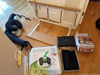 Group shot of bed rail, Revitive IX box, Dr-Ho's packaging, therapy unit case, neck pillow, brace, sandal