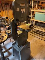 Full view of King Canada KC-514C band saw showing upper wheel housing, table, and base cabinet