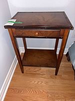 Full view of wood night stand showing drawer and shelf
