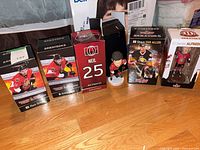 Group of five Ottawa Senators bobbleheads and their packaging