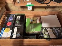 Overview of five boxed outdoor lighting items inside wooden chest